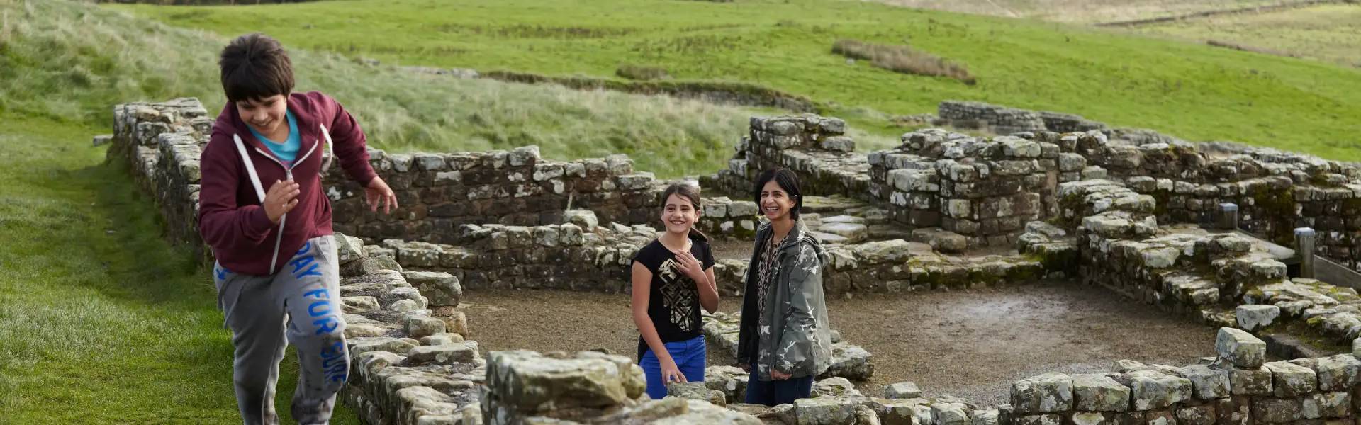 Family explore Housesteads